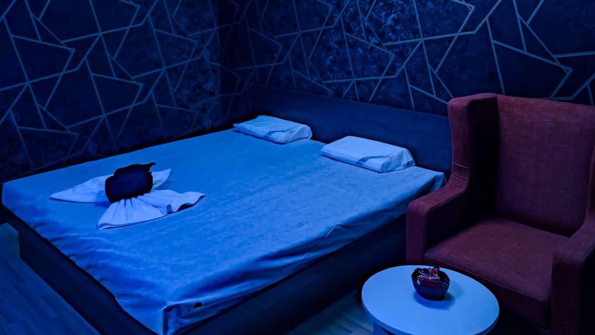 Private room with ambient blue lighting at Aurora International Spa