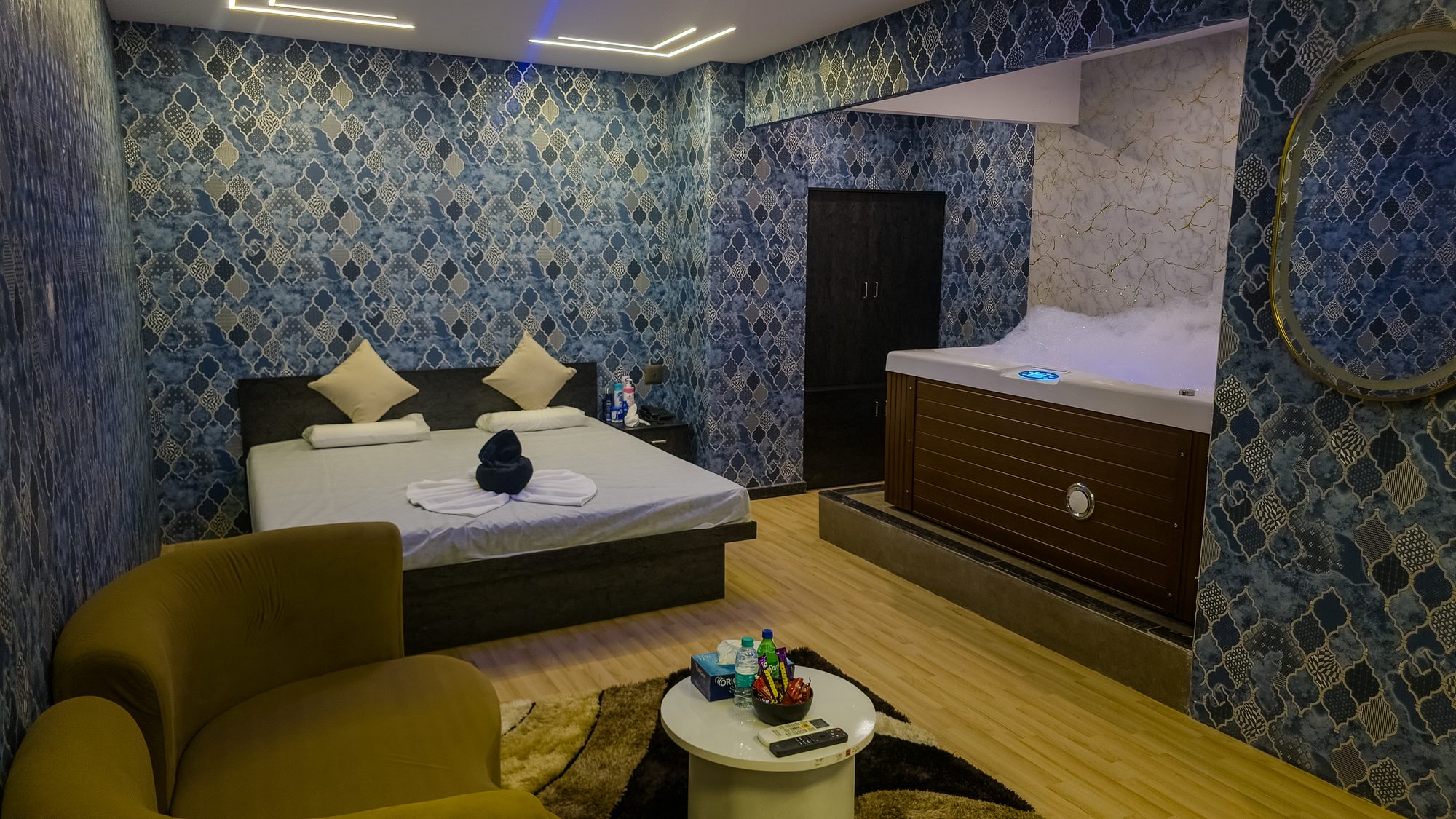 Private room with jacuzzi and lounge seating at Aurora International Spa