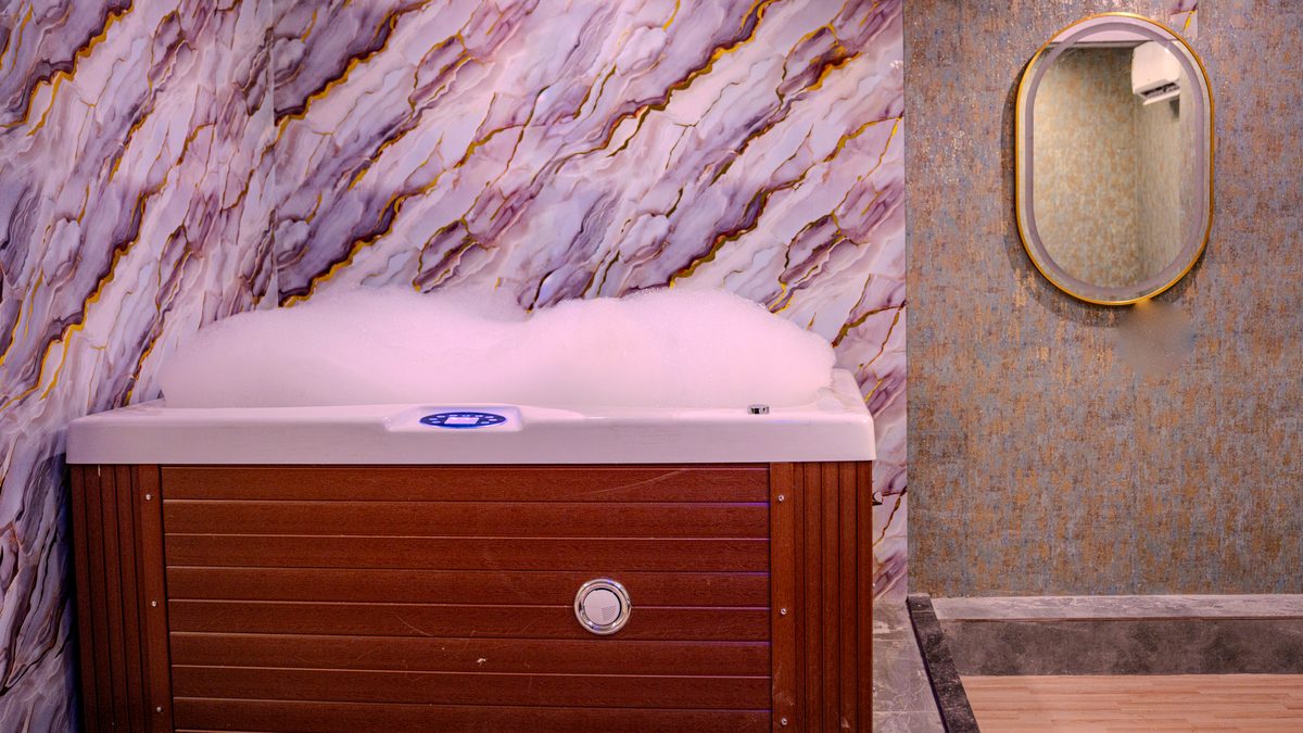 Jacuzzi with marble wall at Aurora International Spa